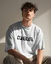 genz-model-with-curly-hair-posing-in-tshirt-mockup-0270 (26).webp