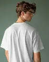 young-male-model-wearing-tshrit-mockup-against-green-background-scene1-0280.webp