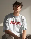genz-model-with-curly-hair-posing-in-tshirt-mockup-0270 (4).webp